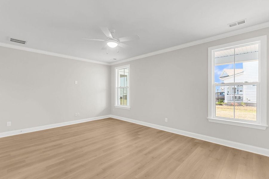 Spacious, unfurnished interior of a new home in Tidewater at Lakes of Cane Bay, Summerville (Image 23).