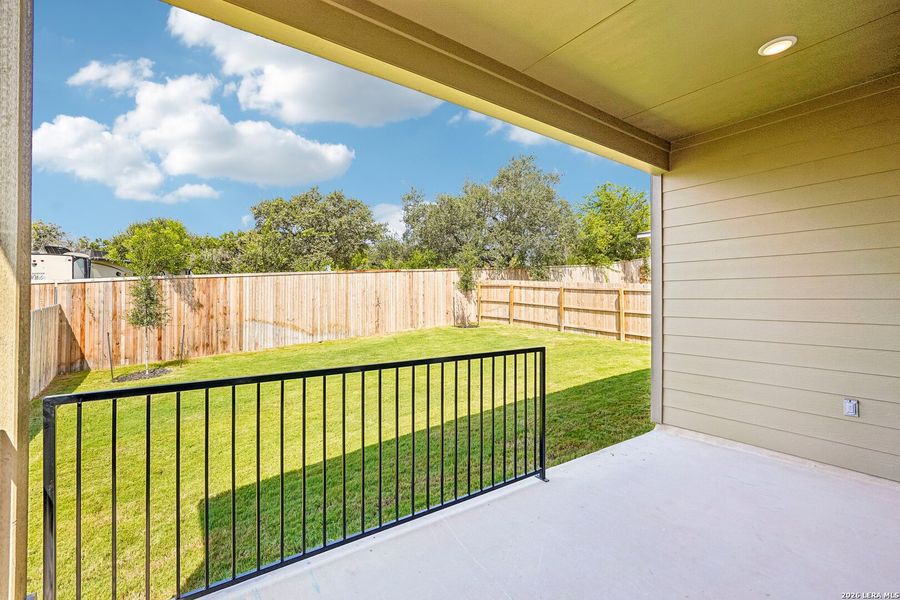 Exterior details and patio area of a home in Weston Oaks, San Antonio (Image 24).