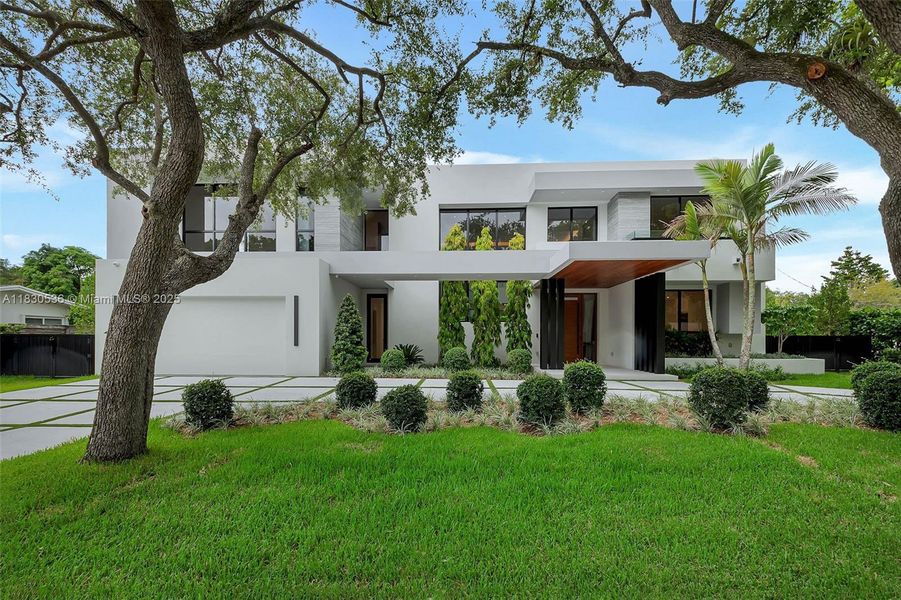Front exterior of a new home in , Pinecrest, FL, highlighting curb appeal (Image 27).