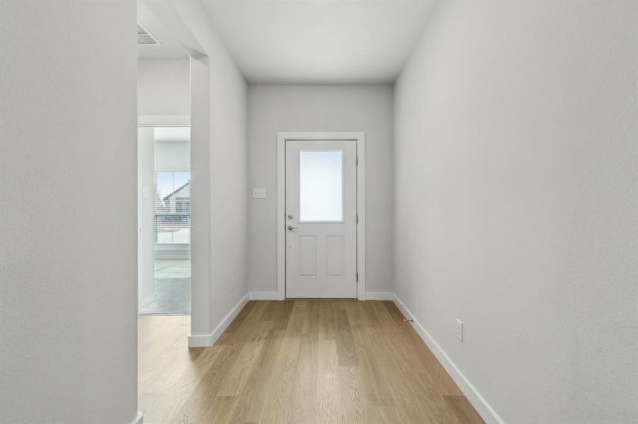 Entryway in the Heisman home plan by Trophy Signature Homes – REPRESENTATIVE PHOTO