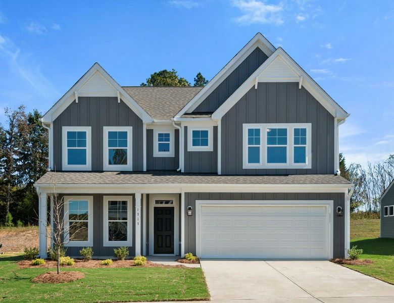 Front exterior of a new home in Wexford, Elon, NC, highlighting curb appeal (Image 1). Front exterior of a new home in Wexford, Elon, NC, highlighting curb appeal (Image 1).