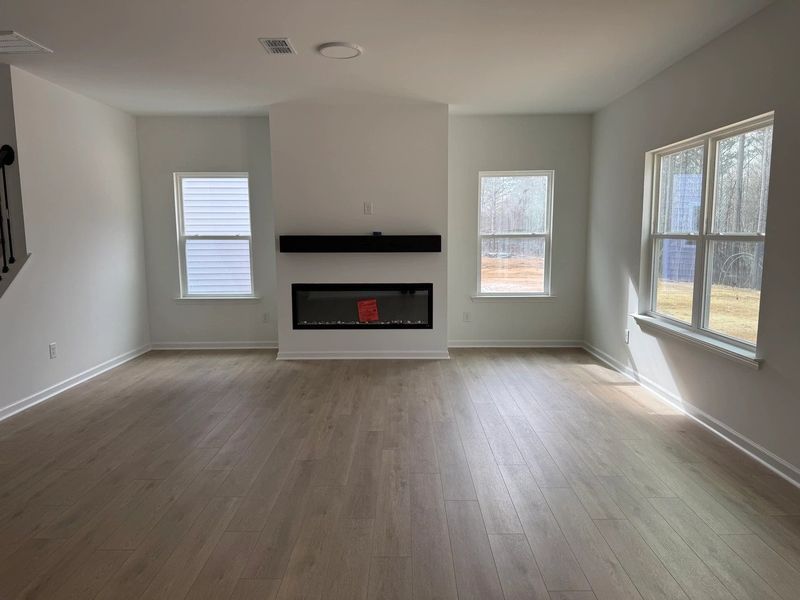 Family Room featuring the AW Collection® Serene - Open space with natural finishes and light. Family Room featuring the AW Collection® Serene - Open space with natural finishes and light.