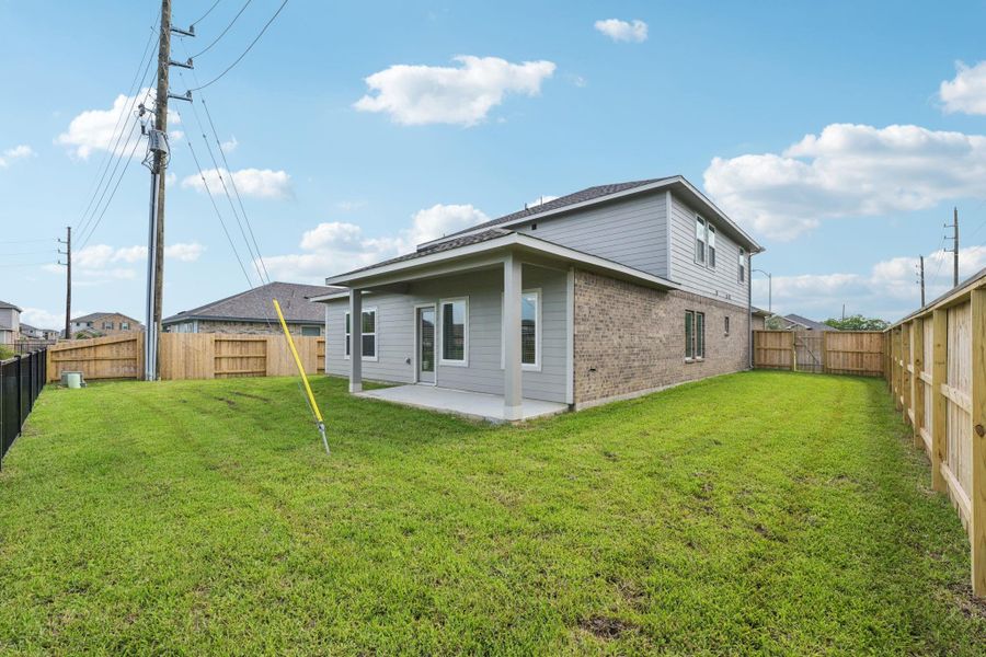 Front exterior of a new home in Heights of Barbers Hill, Mont Belvieu, TX, highlighting curb appeal (Image 19).