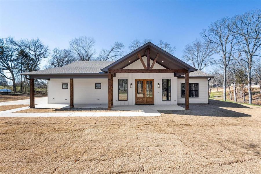 Rear view of house featuring french doors