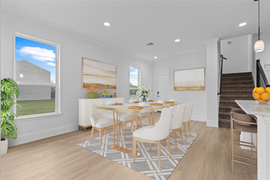 The casual dining area has walls of tall, insulated vinyl windows for all that natural lighting and keeps all the heat and cold out!  Stunning new custom home to call home!  Start your memories today!