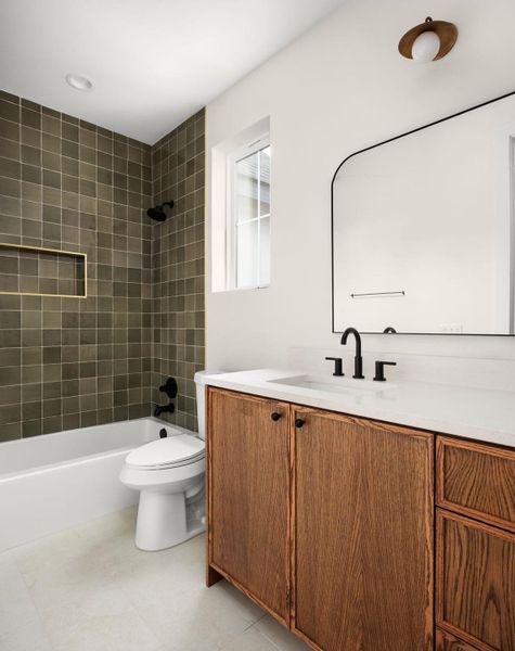 Bathroom featuring vanity and shower / bathtub combination