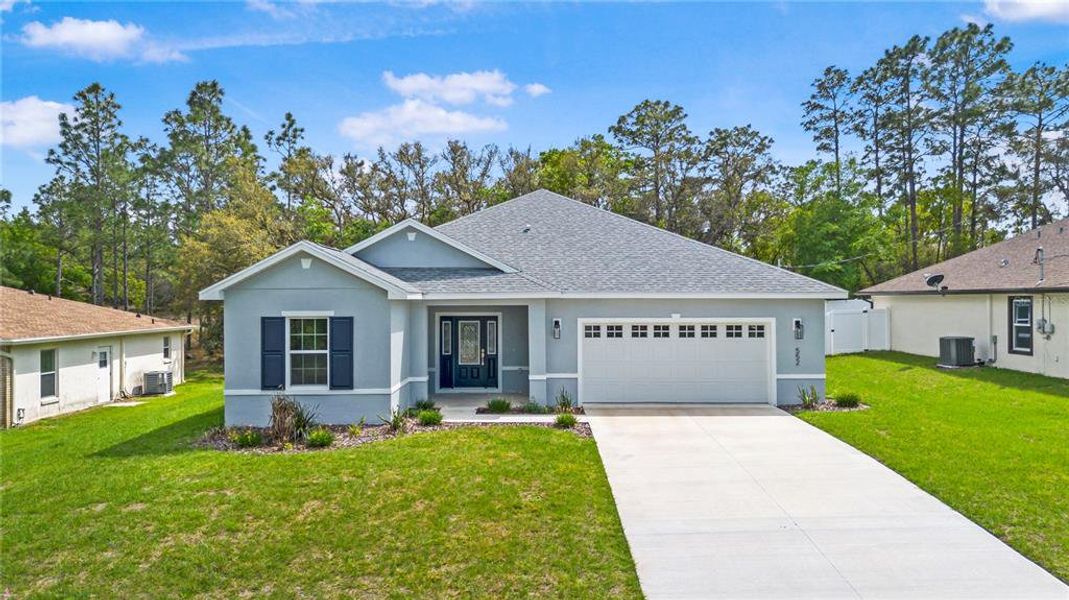 Front exterior of a new home in , Citrus Springs, FL, highlighting curb appeal (Image 24).
