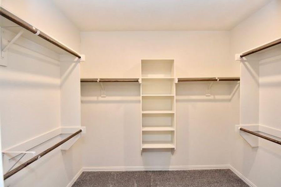 Spacious walk-in closet in the primary bedroom