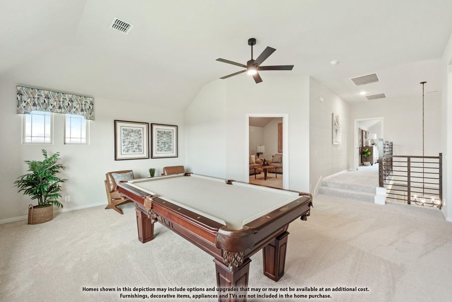 Game room with pool table, vaulted ceiling, ceiling fan, and carpet flooring Game room with pool table, vaulted ceiling, ceiling fan, and carpet flooring