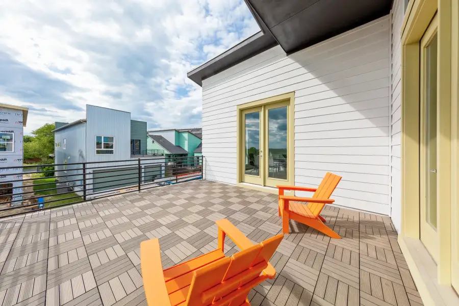 Exterior details and patio area of a home in The Brownstones at East Quarter, Dallas (Image 22).