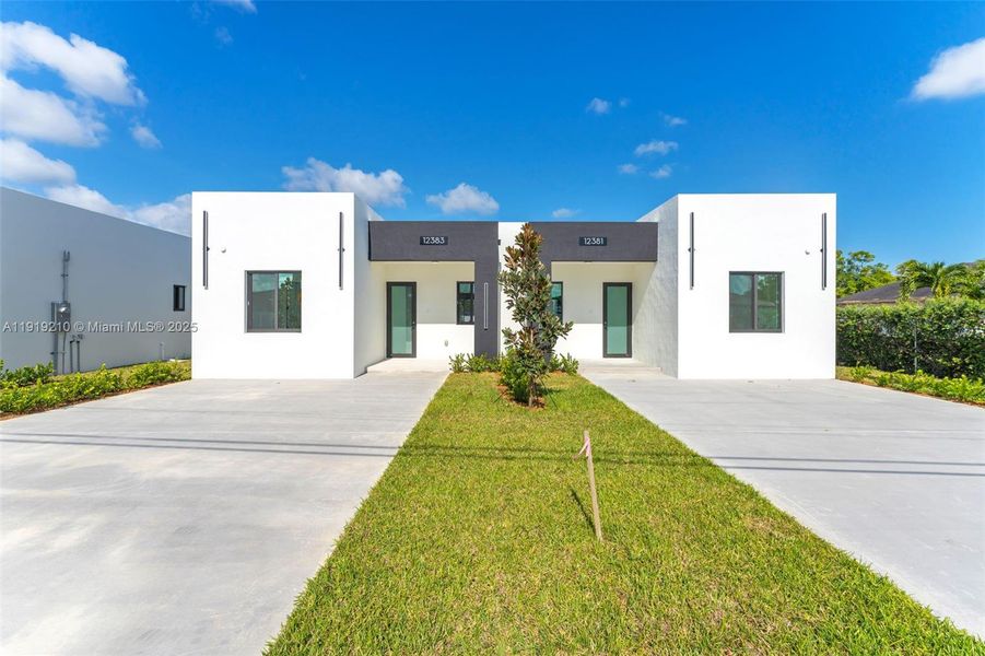 Front exterior of a new home in , Miami, FL, highlighting curb appeal (Image 1).