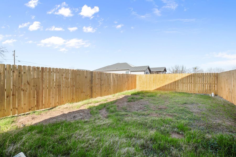 View of fenced backyard