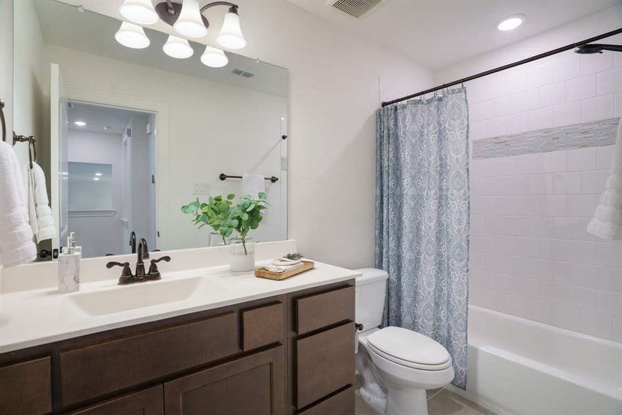 In line with the rest of the home, the bathroom showcases clean, timeless design choices that make it both beautiful and functional.