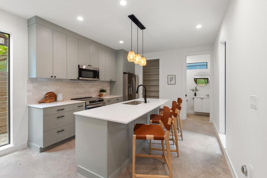 The spacious kitchen offers ample room for cooking, gathering, and entertaining. The spacious kitchen offers ample room for cooking, gathering, and entertaining.