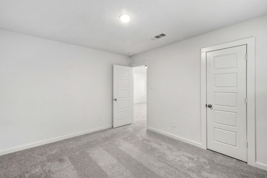 Spacious, unfurnished interior of a new home in Pinewood at Grand Texas, New Caney (Image 14).