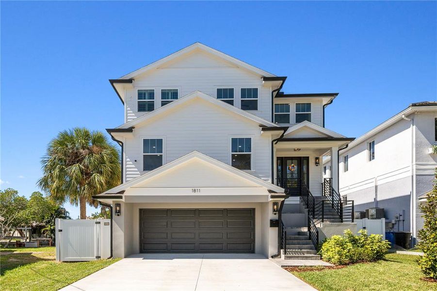 Front exterior of a new home in , St. Petersburg, FL, highlighting curb appeal (Image 1). Front exterior of a new home in , St. Petersburg, FL, highlighting curb appeal (Image 1).