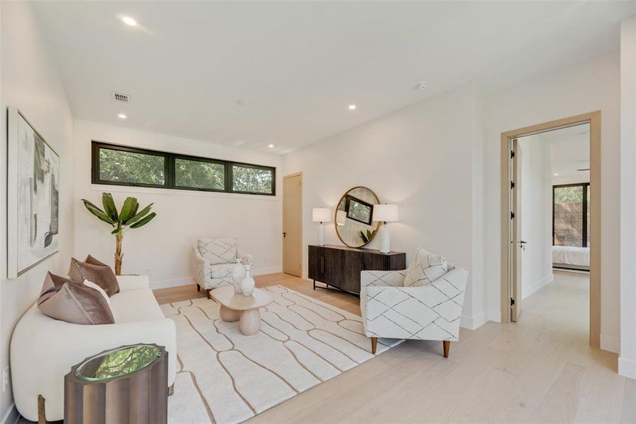 Living room with light wood-type flooring