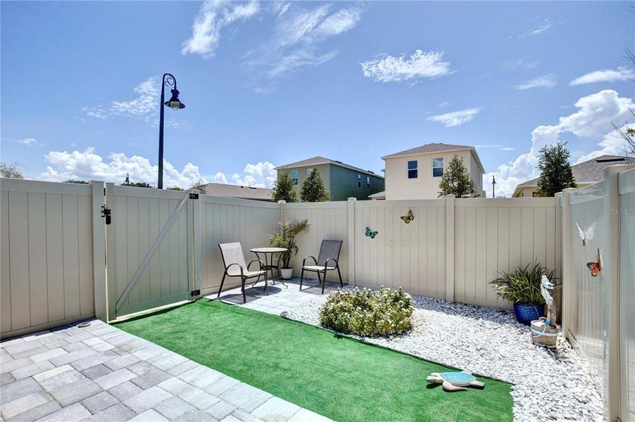 Exterior details and patio area of a home in Windrose, Apopka (Image 24).