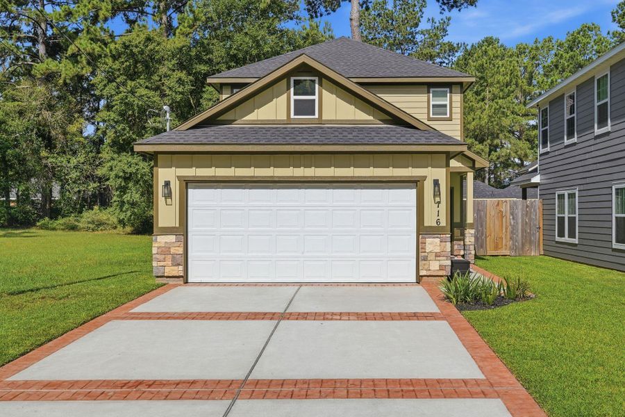 Front exterior of a new home in , Conroe, TX, highlighting curb appeal (Image 1). Front exterior of a new home in , Conroe, TX, highlighting curb appeal (Image 1).