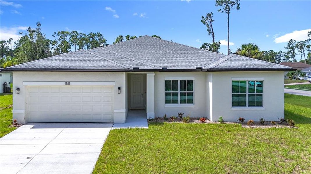 Front exterior of a new home in , North Port, FL, highlighting curb appeal (Image 1). Front exterior of a new home in , North Port, FL, highlighting curb appeal (Image 1).