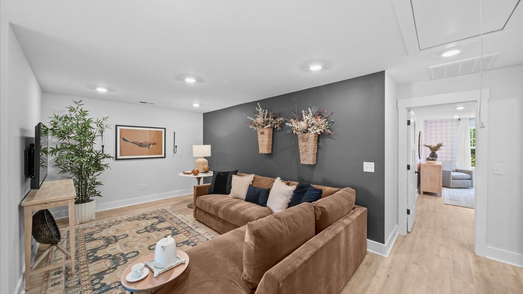 Hardwood flooring enhances the versatility of this elegant upper-level loft space in Fountain Inn, SC