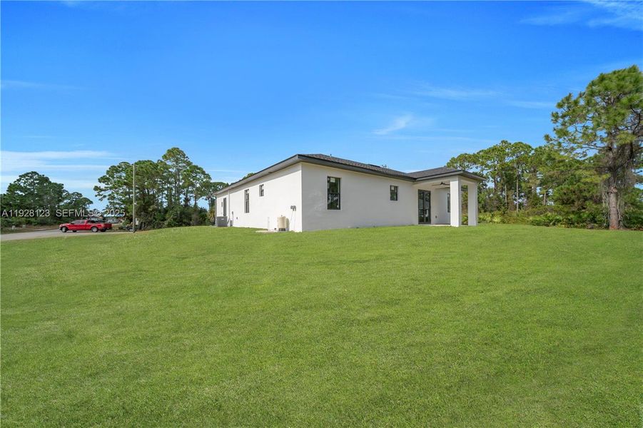 Exterior details and patio area of a home in , Lehigh Acres (Image 16). Exterior details and patio area of a home in , Lehigh Acres (Image 16).