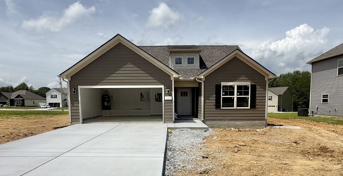 Front exterior of a new home in Stone Fort Meadows, Manchester, TN, highlighting curb appeal (Image 1). Front exterior of a new home in Stone Fort Meadows, Manchester, TN, highlighting curb appeal (Image 1).