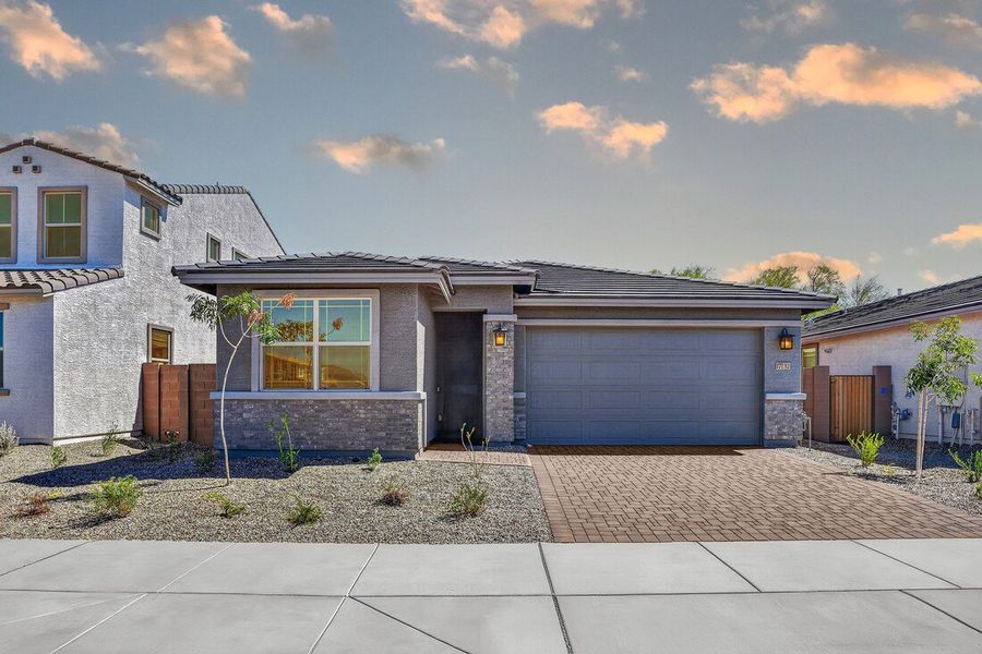 Front exterior of a new home in Artisan at Asante, Surprise, AZ, highlighting curb appeal (Image 19).