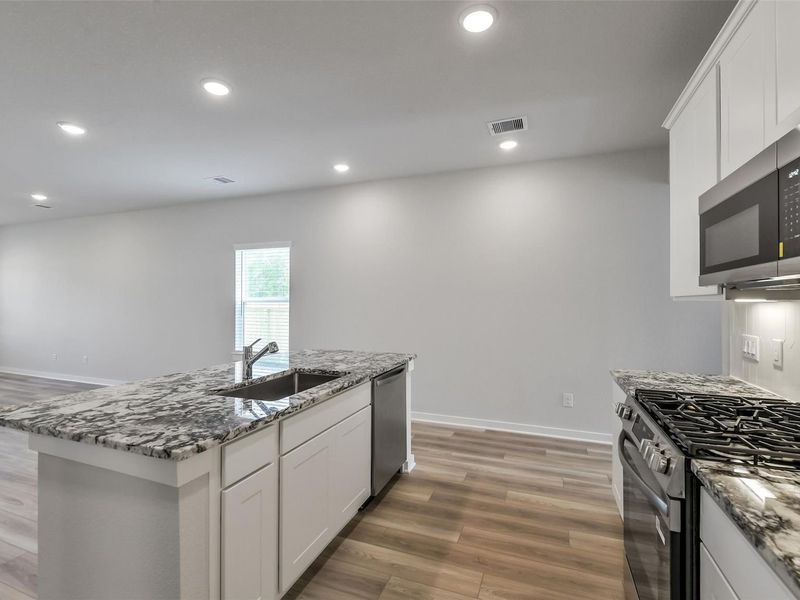 Furnished interior view inside a new home in Caney Creek Place, Conroe (Image 9).