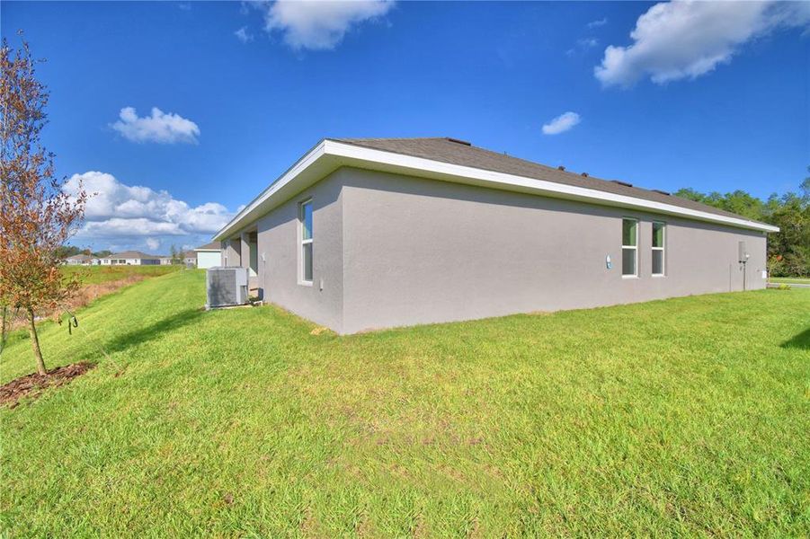 Exterior details and patio area of a home in Cadence Crossing, Auburndale (Image 24).