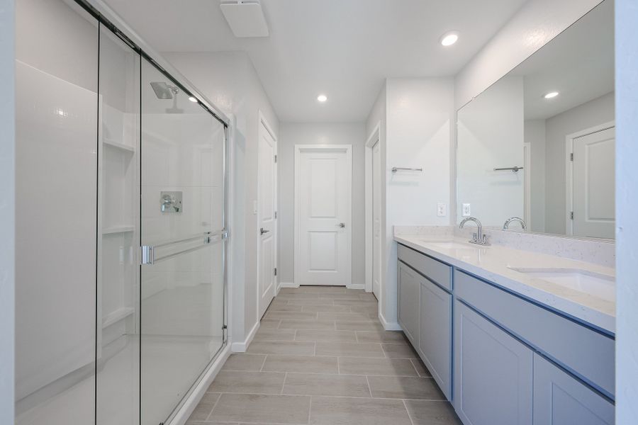 A bathroom with white cabinets. A bathroom with white cabinets.