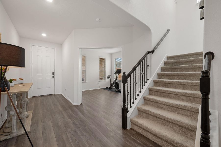 Entryway featuring wood finished floors and recessed lighting