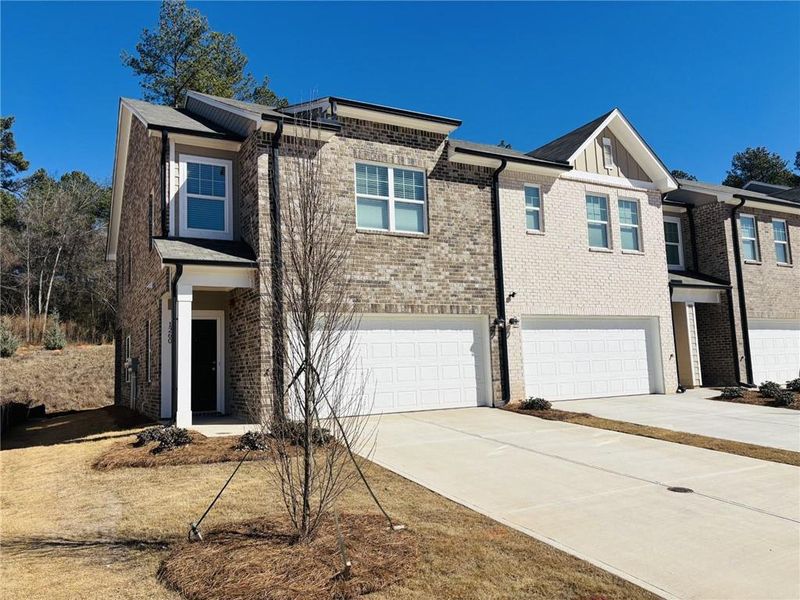 Front exterior of a new home in Kendall Grove, McDonough, GA, highlighting curb appeal (Image 10).