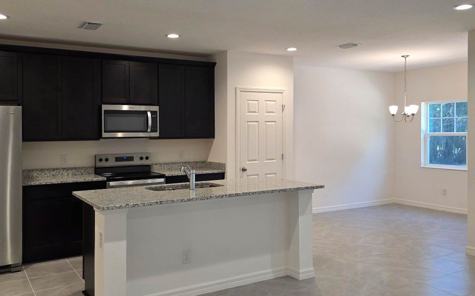 Furnished interior view inside a new home in Blue Springs Reserve Townhomes, Groveland (Image 5). Furnished interior view inside a new home in Blue Springs Reserve Townhomes, Groveland (Image 5).