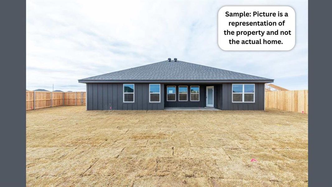 Rear view of property with a shingled roof, a fenced backyard, a patio area, and board and batten siding