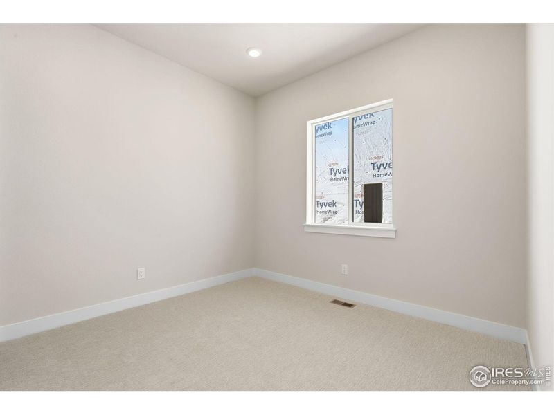 Spacious, unfurnished interior of a new home in Festival at RainDance, Windsor (Image 10).