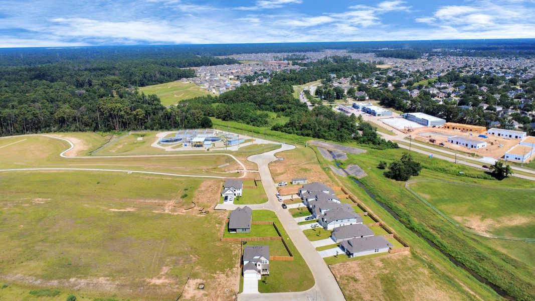 An aerial view of a spacious subdivision lot, highlighting a well-maintained yard and a fully fenced perimeter, offering both privacy and expansive outdoor space. An aerial view of a spacious subdivision lot, highlighting a well-maintained yard and a fully fenced perimeter, offering both privacy and expansive outdoor space.