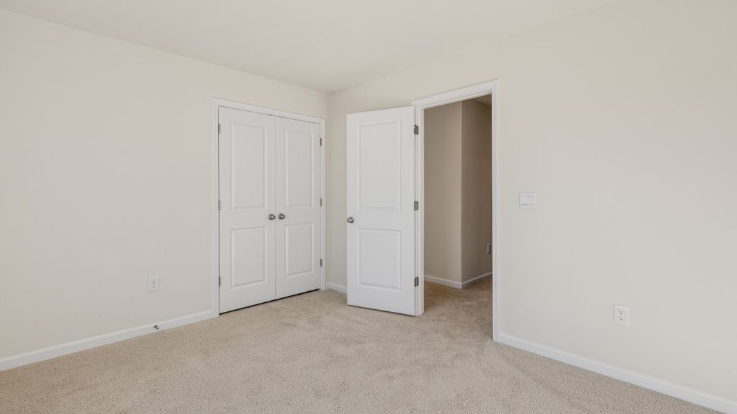 Spacious, unfurnished interior of a new home in The Grove at Matthews Landing, Fuquay Varina (Image 28).