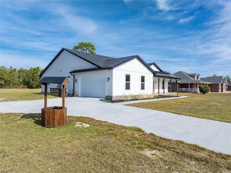 Front exterior of a new home in , Lake City, FL, highlighting curb appeal (Image 24).