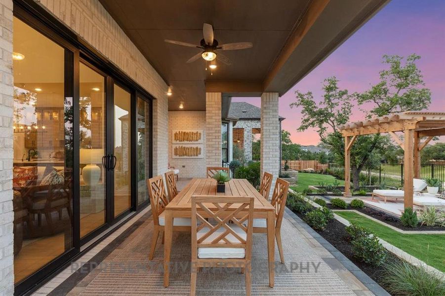 View of patio / terrace with outdoor dining area, ceiling fan, and a pergola View of patio / terrace with outdoor dining area, ceiling fan, and a pergola