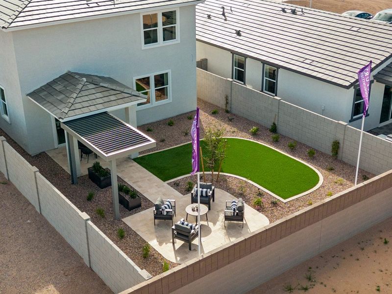 A building with a lawn and cars.