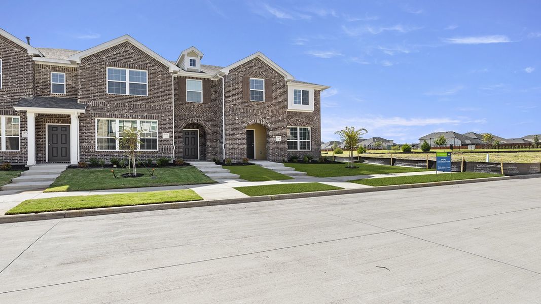 Front exterior of a new home in Heartland Townhomes, Heartland, TX, highlighting curb appeal (Image 18).
