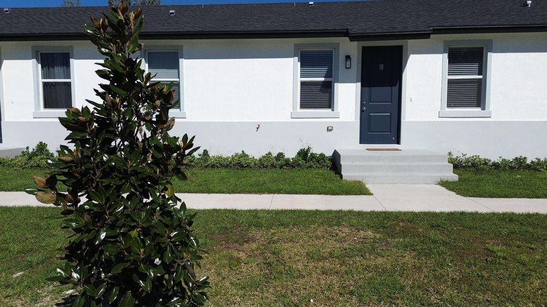 Front exterior of a new home in , Rotonda West, FL, highlighting curb appeal (Image 18).