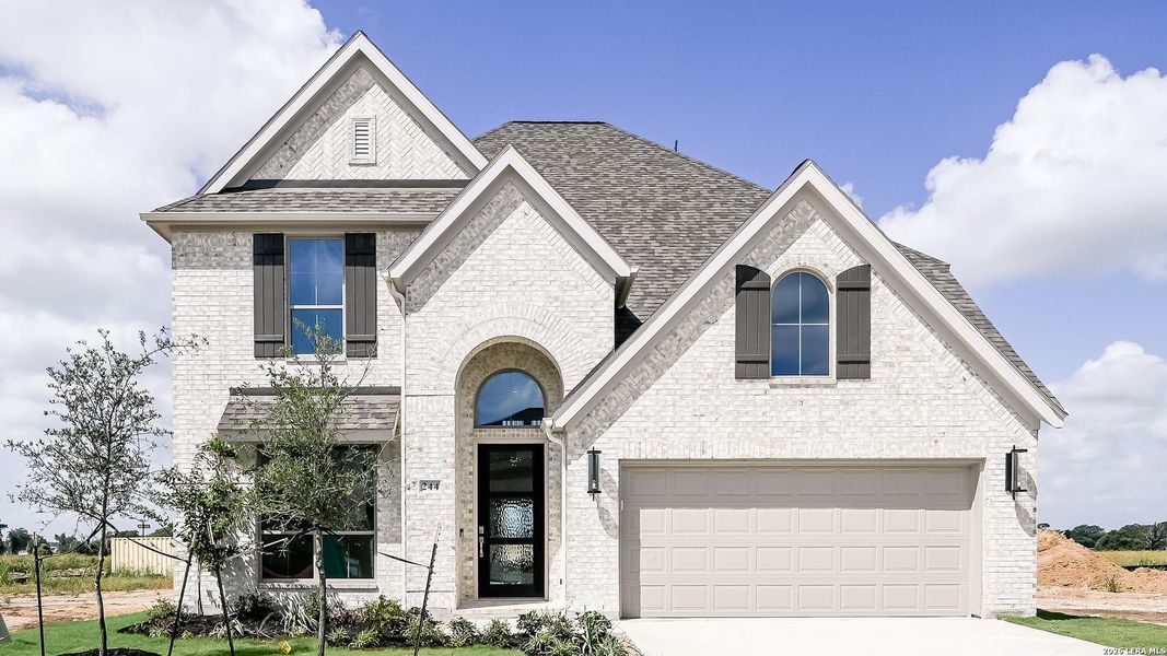 Front exterior of a new home in Legacy at Lake Dunlap, New Braunfels, TX, highlighting curb appeal (Image 1). Front exterior of a new home in Legacy at Lake Dunlap, New Braunfels, TX, highlighting curb appeal (Image 1).
