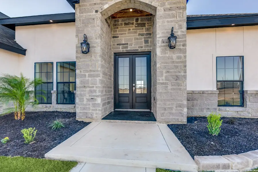 Exterior details and patio area of a home in , Atascosa (Image 3).