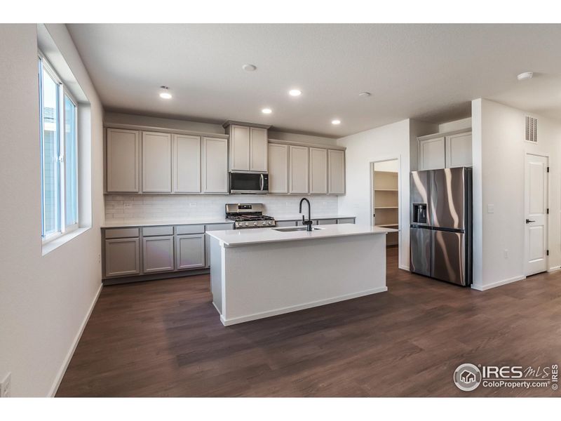 Furnished interior view inside a new home in Bloom Trailblazer Collection - Single Family Homes, Fort Collins (Image 14).