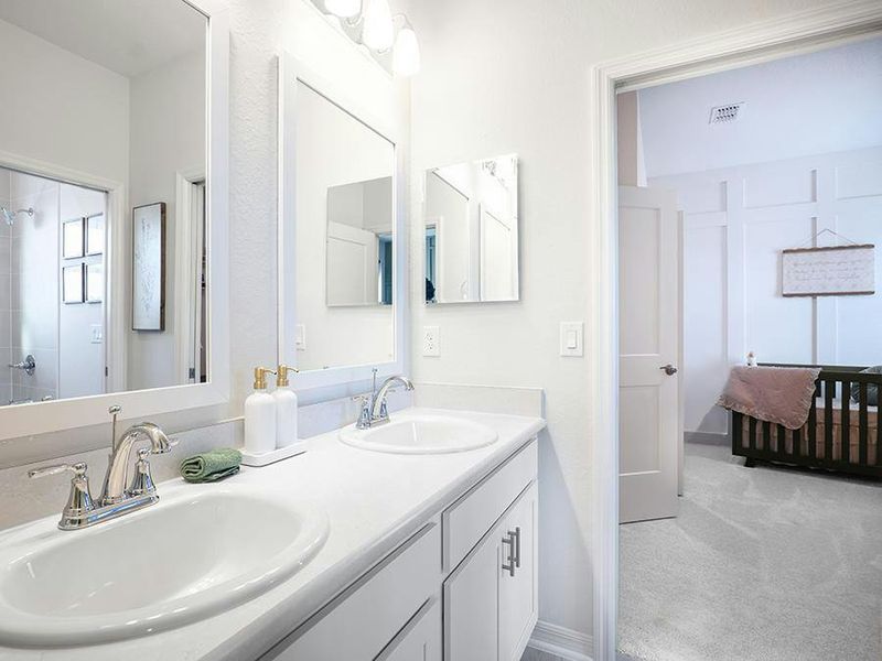 Secondary bedrooms share a Jack-and-Jill bath - Shelby II by Highland Homes