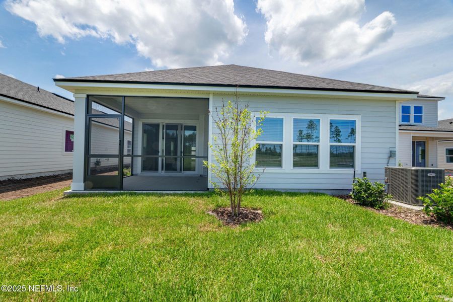 Front exterior of a new home in Beacon Lake, St. Augustine, FL, highlighting curb appeal (Image 34).