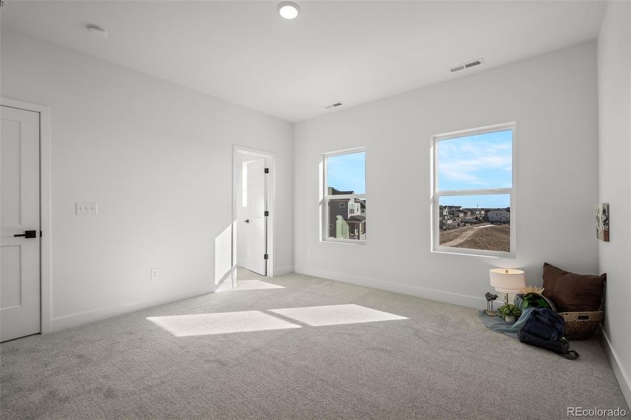 Spacious, unfurnished interior of a new home in Revel Crossing at Wolf Ranch - The Panorama Collection, Colorado Springs (Image 22).
