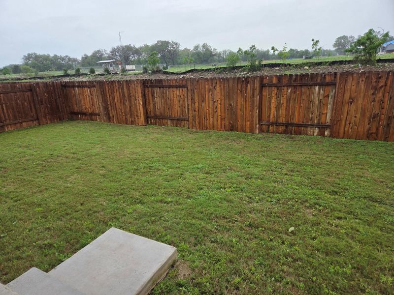 Expansive backyard with a full privacy fence